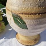 Handcrafted jug or jar with a handle, terracotta pottery vase, fat lava effect, stylized flowers