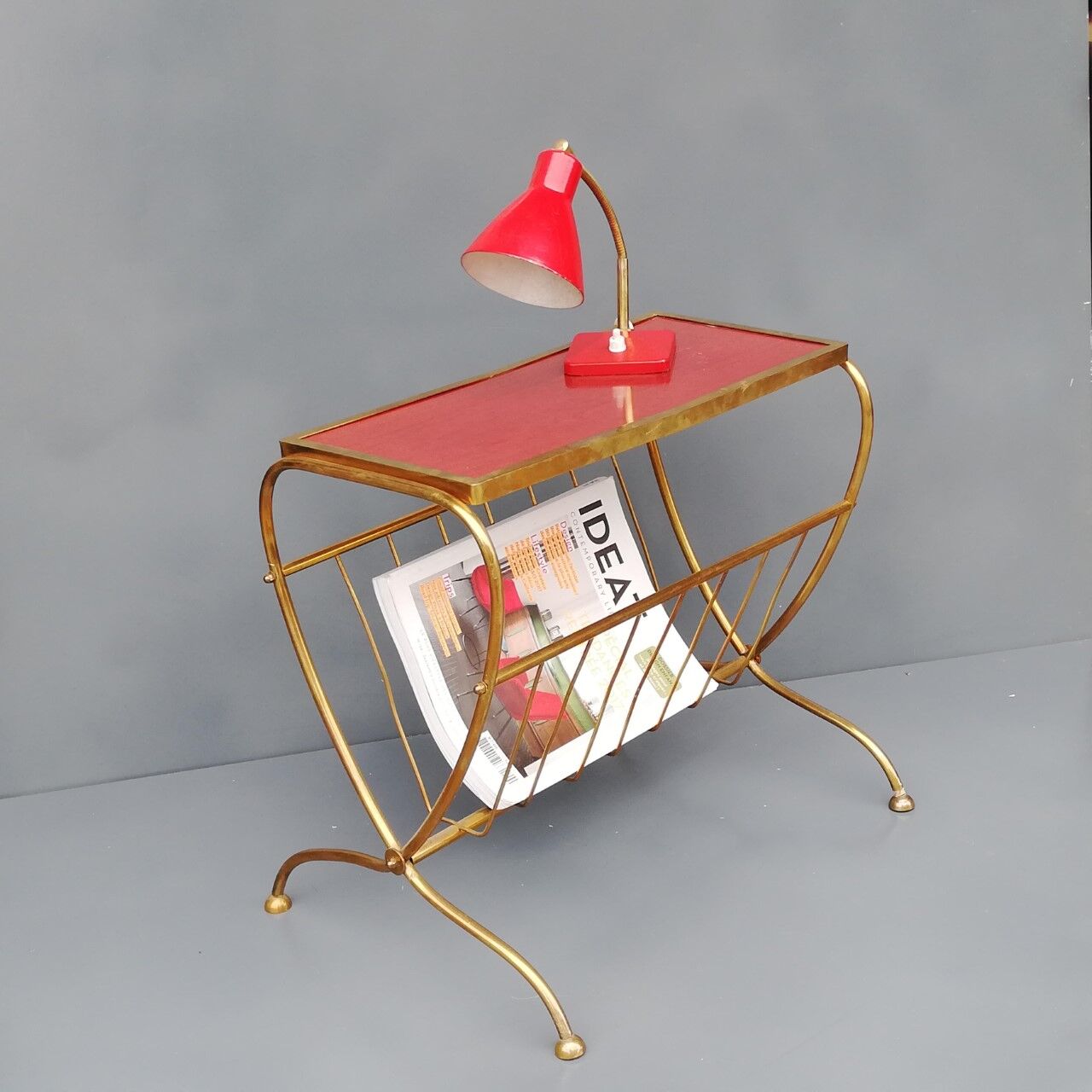 Brass side table with vintage magazine rack