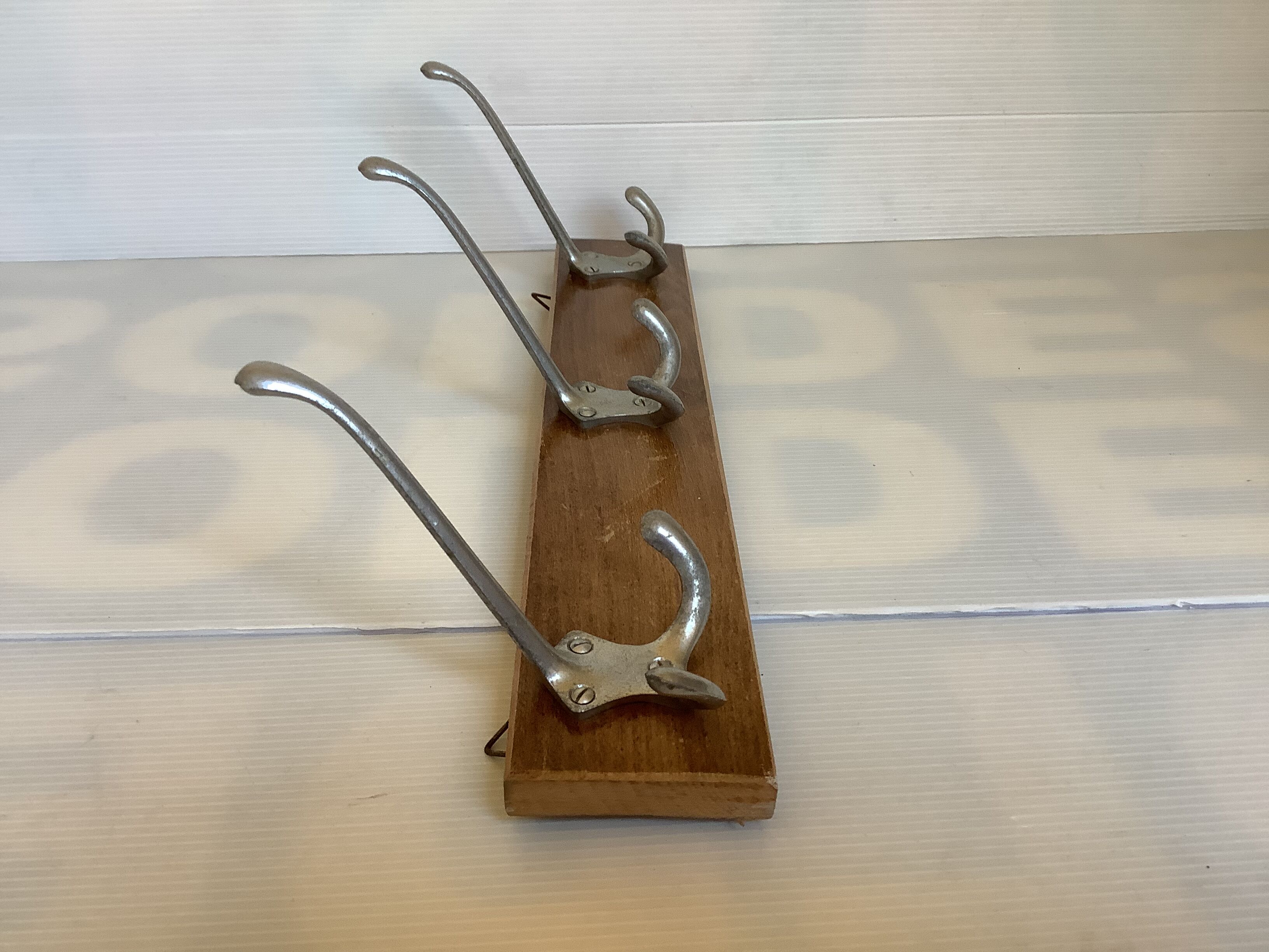 Old coat rack wood metal three hooks