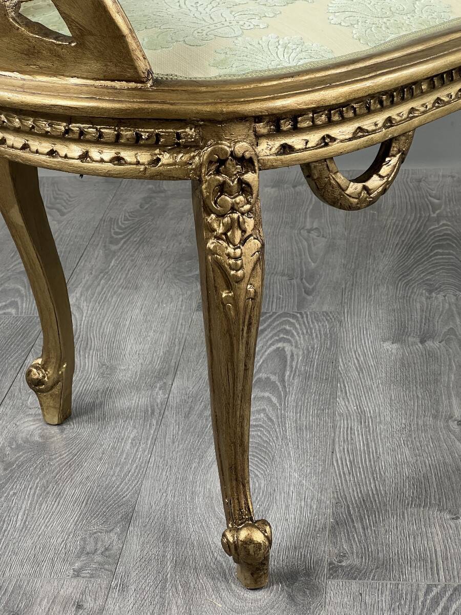 Louis XV style bench in carved and gilded wood, 20th century.