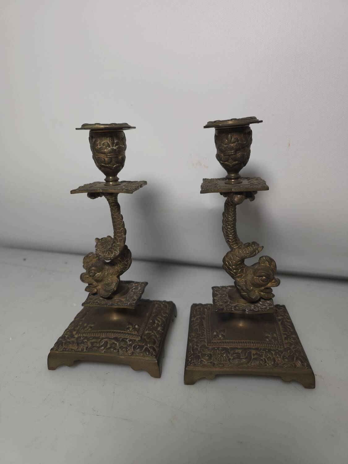 Pair of candlesticks with bronze dolphins