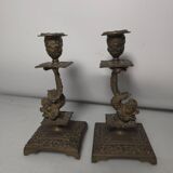 Pair of candlesticks with bronze dolphins