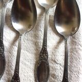 A set of 6 silver-plated metal soup spoons with foliage design.