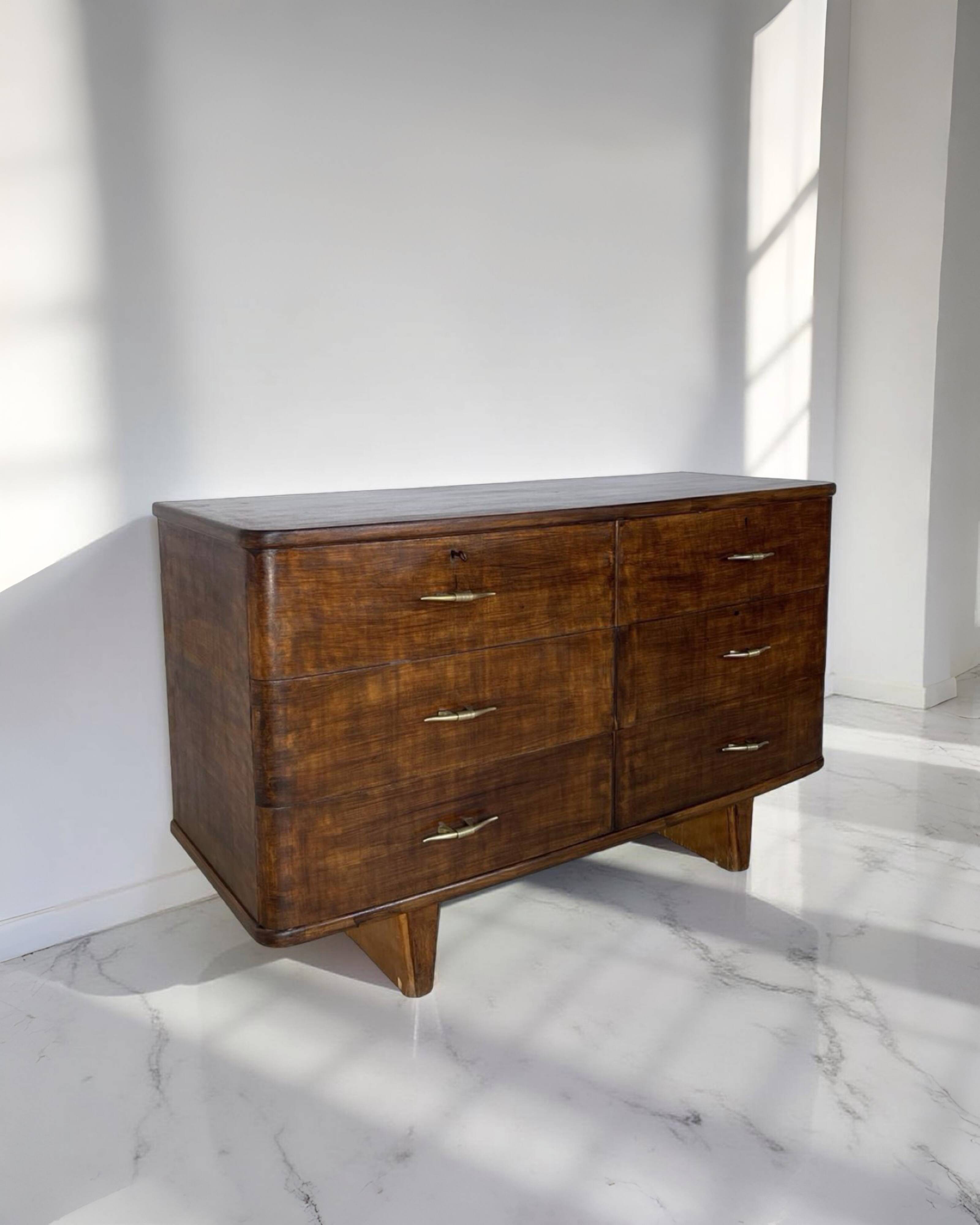 A vintage Italian chest of drawers, made of veneered walnut and solid wood,