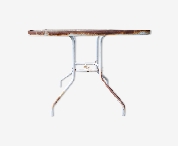 Patinated garden pedestal table