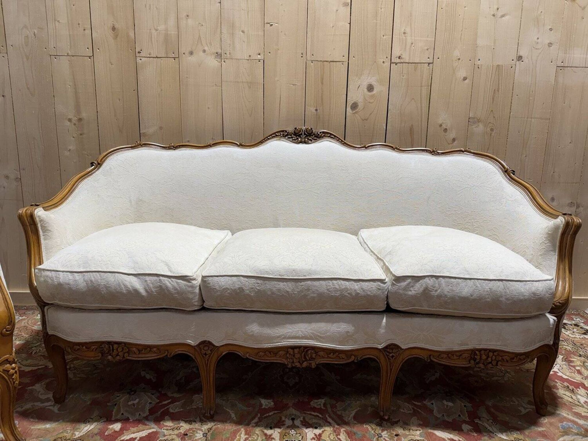 Beige Louis XV style salon sofa and pair of armchairs.