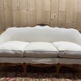 Beige Louis XV style salon sofa and pair of armchairs.