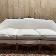 Beige Louis XV style salon sofa and pair of armchairs.