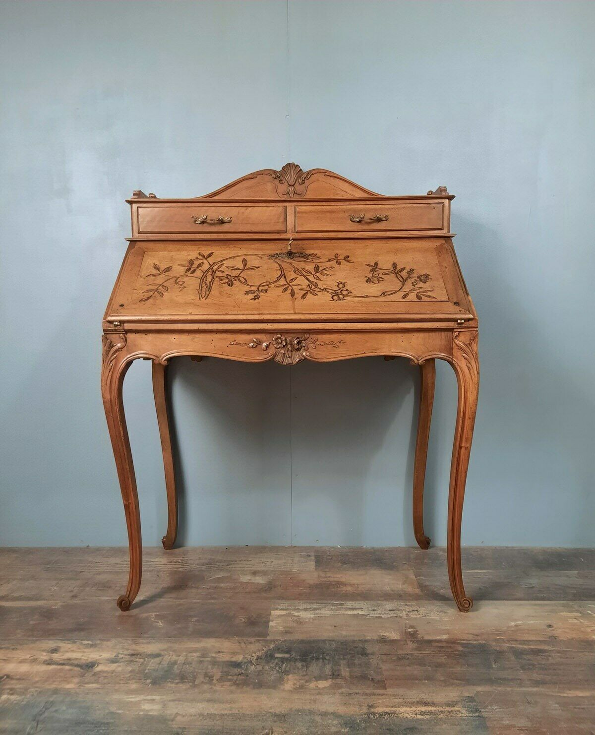 Louis XV style stepped donkey back desk in walnut in early 1900