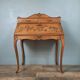 Louis XV style stepped donkey back desk in walnut in early 1900
