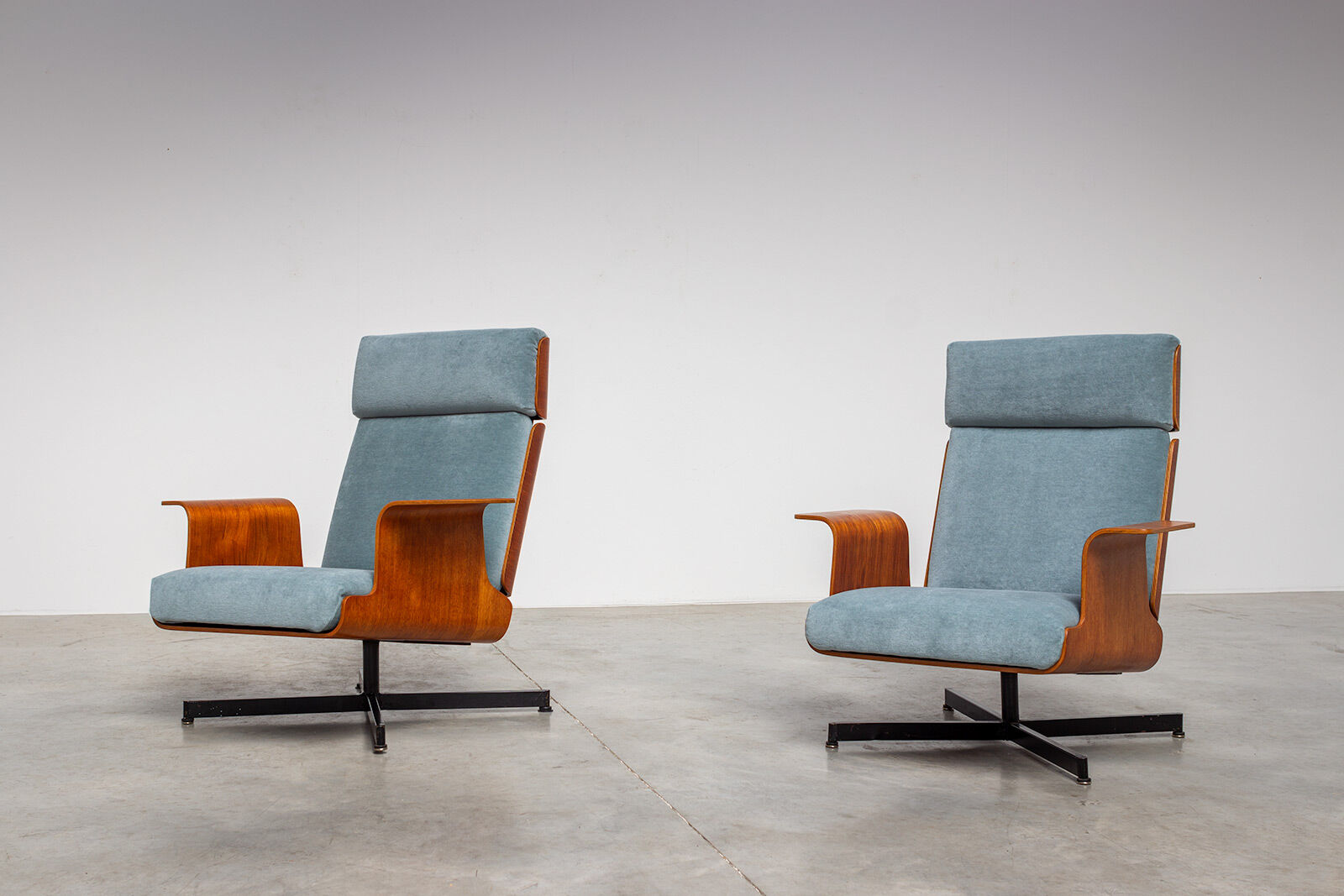 Pair of modernist teak lounge chairs and poufs 1960