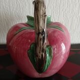 Pink pitcher in the shape of a strawberry, Italian slurry.