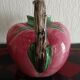 Pink pitcher in the shape of a strawberry, Italian slurry.