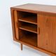 Svend Dyrlund teak sideboard with tambour doors (Denmark, 1960s).