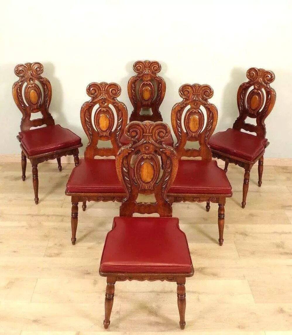 Set of 6 Italian Renaissance style chairs in solid walnut, finely carved.