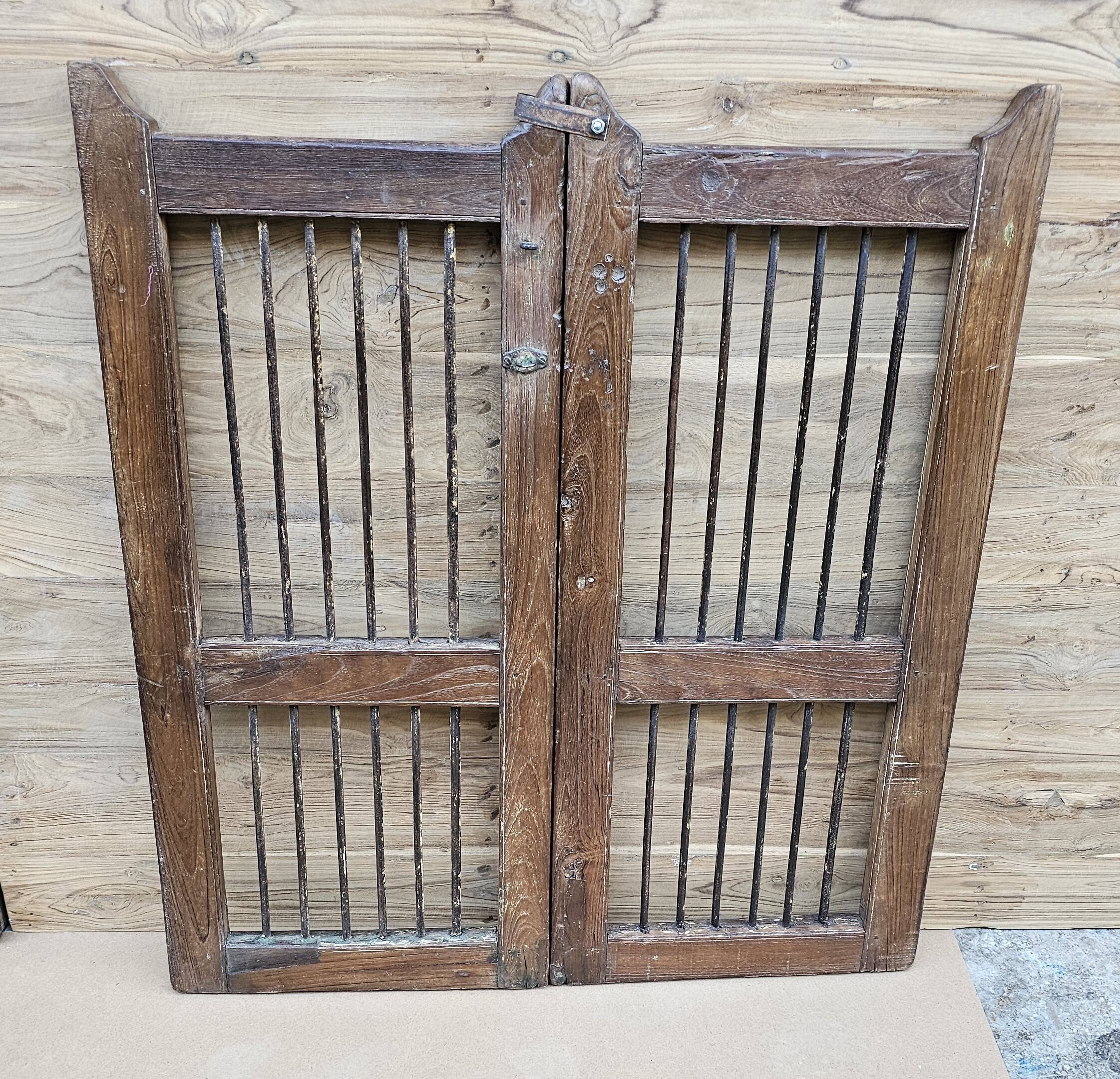 Old gate in Burmese teak and wrought iron