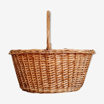 Old woven rattan basket with handle