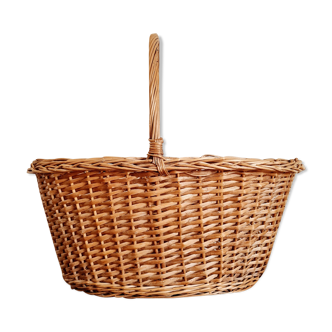 Old woven rattan basket with handle