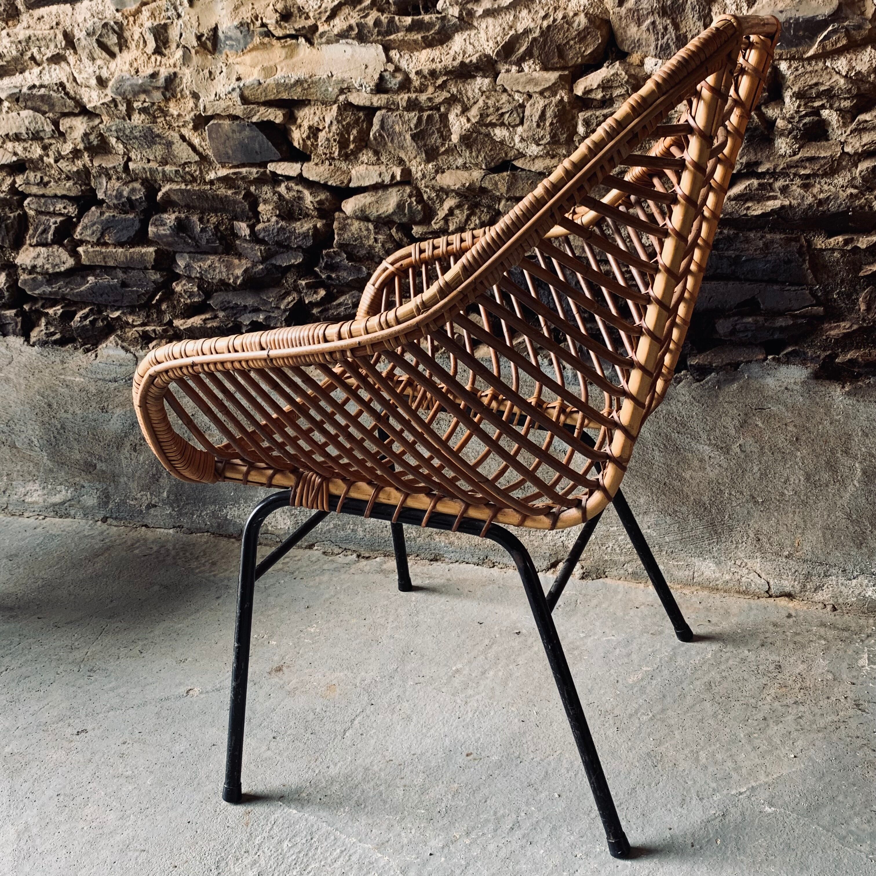 Rattan armchair and black metal base 1960