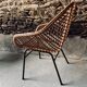 Rattan armchair and black metal base 1960
