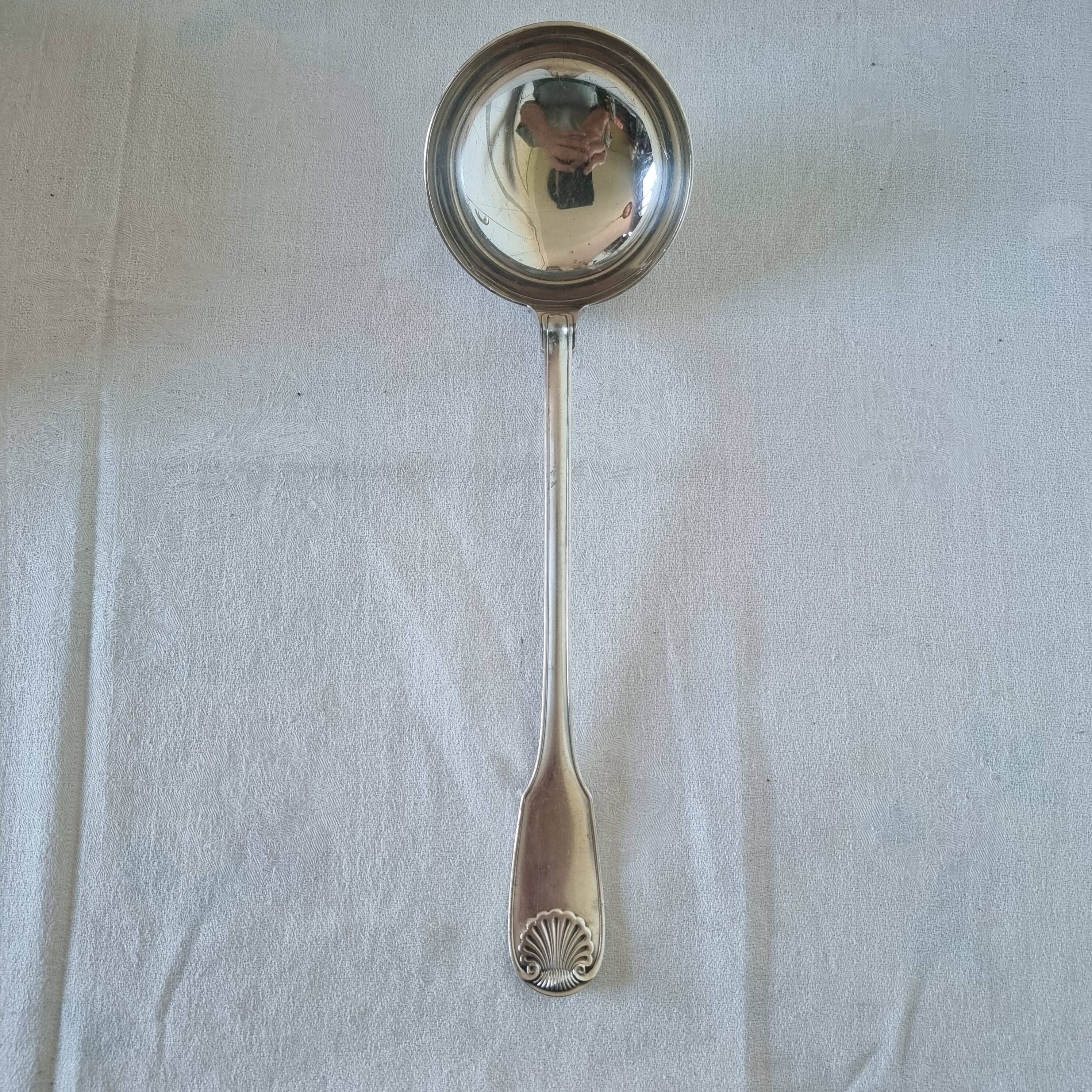 The Christofle silver-plated “Vendôme” cream ladle features a design