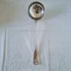 The Christofle silver-plated “Vendôme” cream ladle features a design