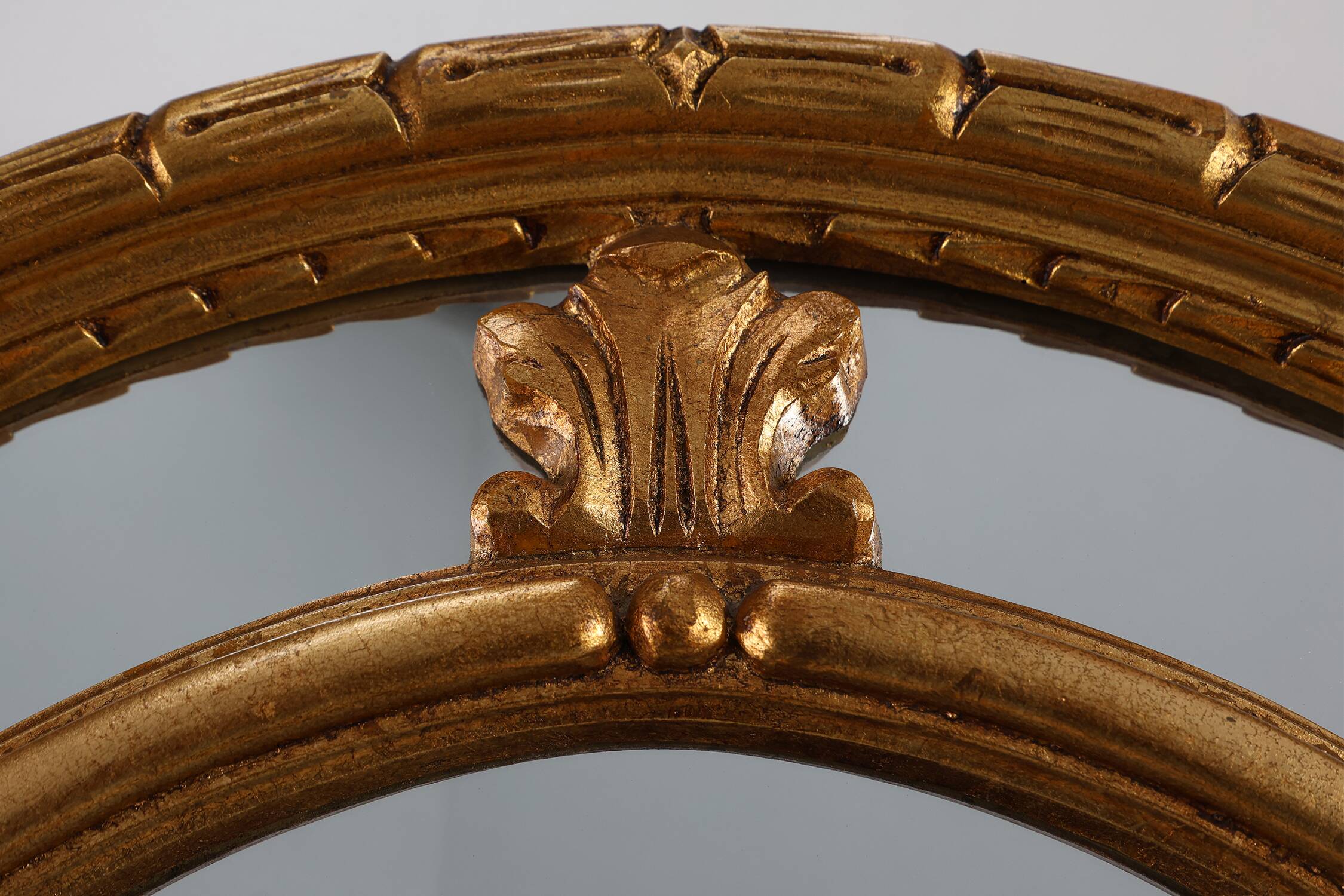 20th century neo-classical style tilted oval mirror by Deknudt, Belgium