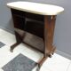 Pink formica magazine table 1950s