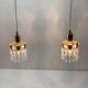 Two gold-plated brass and crystal pendant lights, by Palwa, 1960s design, Hollywood Regency.