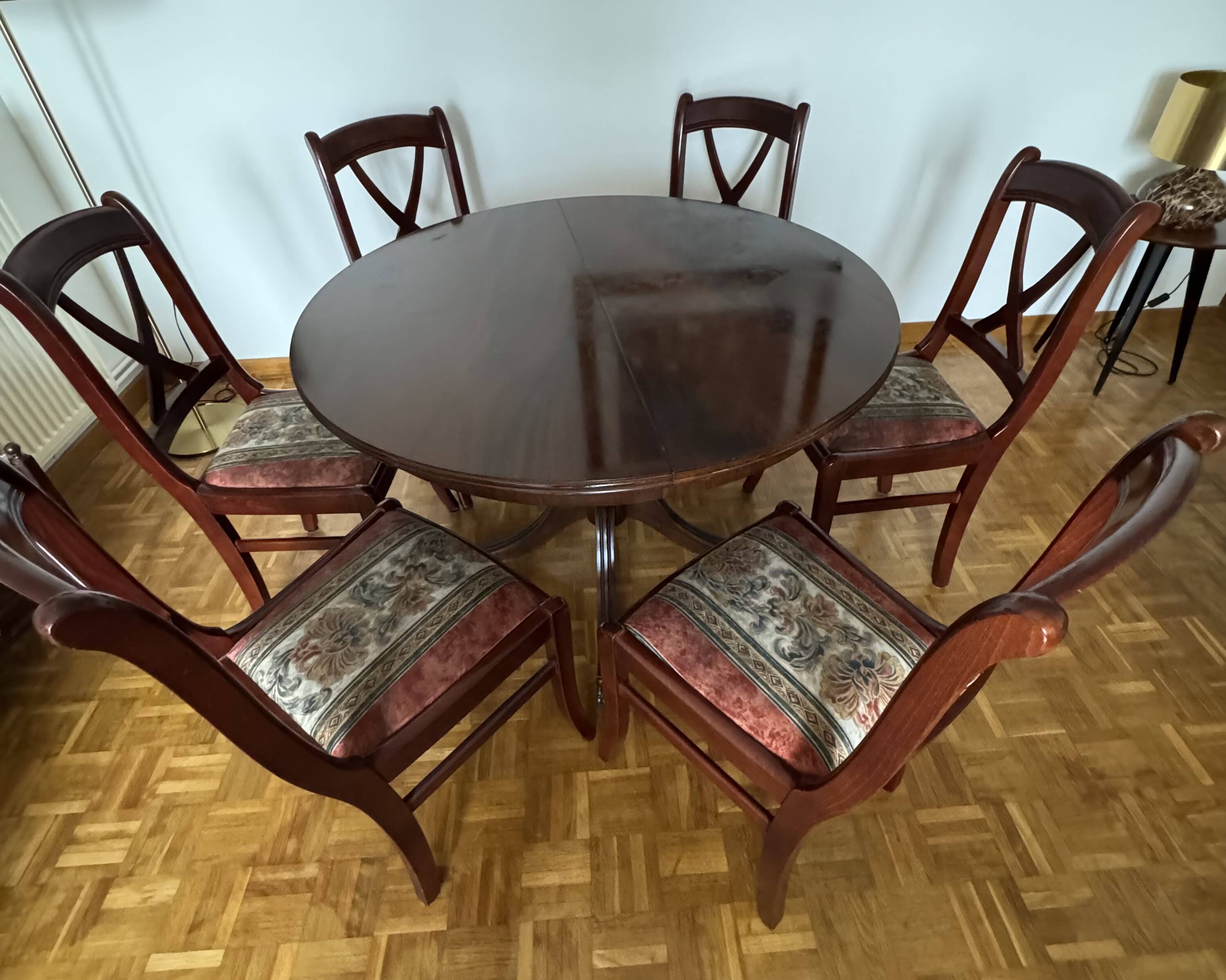 Round mahogany table and beech chairs.