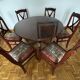 Round mahogany table and beech chairs.