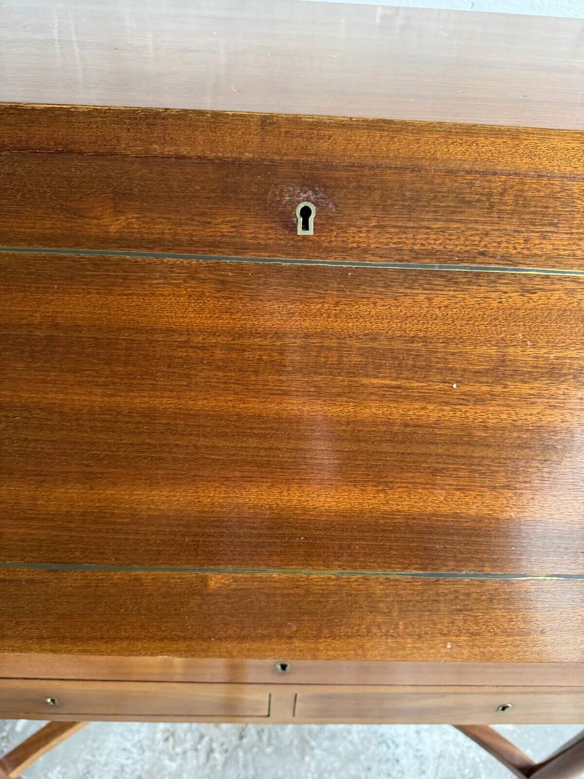 DeCoene antique wood writing desk with beige striped upholstered chair, brass-accented classic set