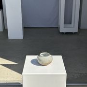 Small white ball vase tight neck in glazed speckled ceramic