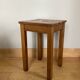 Wooden stool with central grip, quadripod base, 20th century