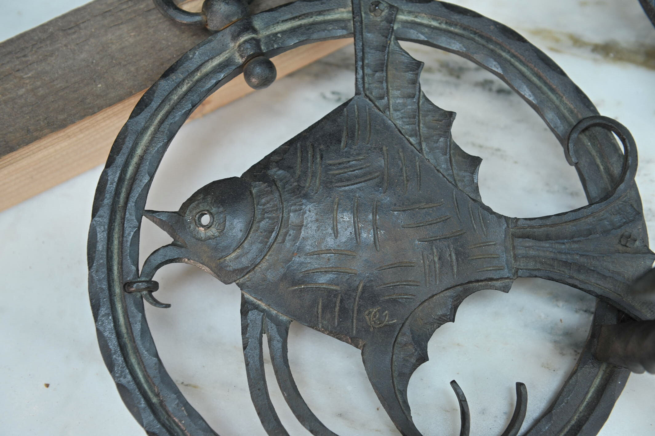 Pair of carved metal wall lamps signed RG