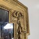 Large gilded wooden mirror in Louis XVI style from the late 19th century.