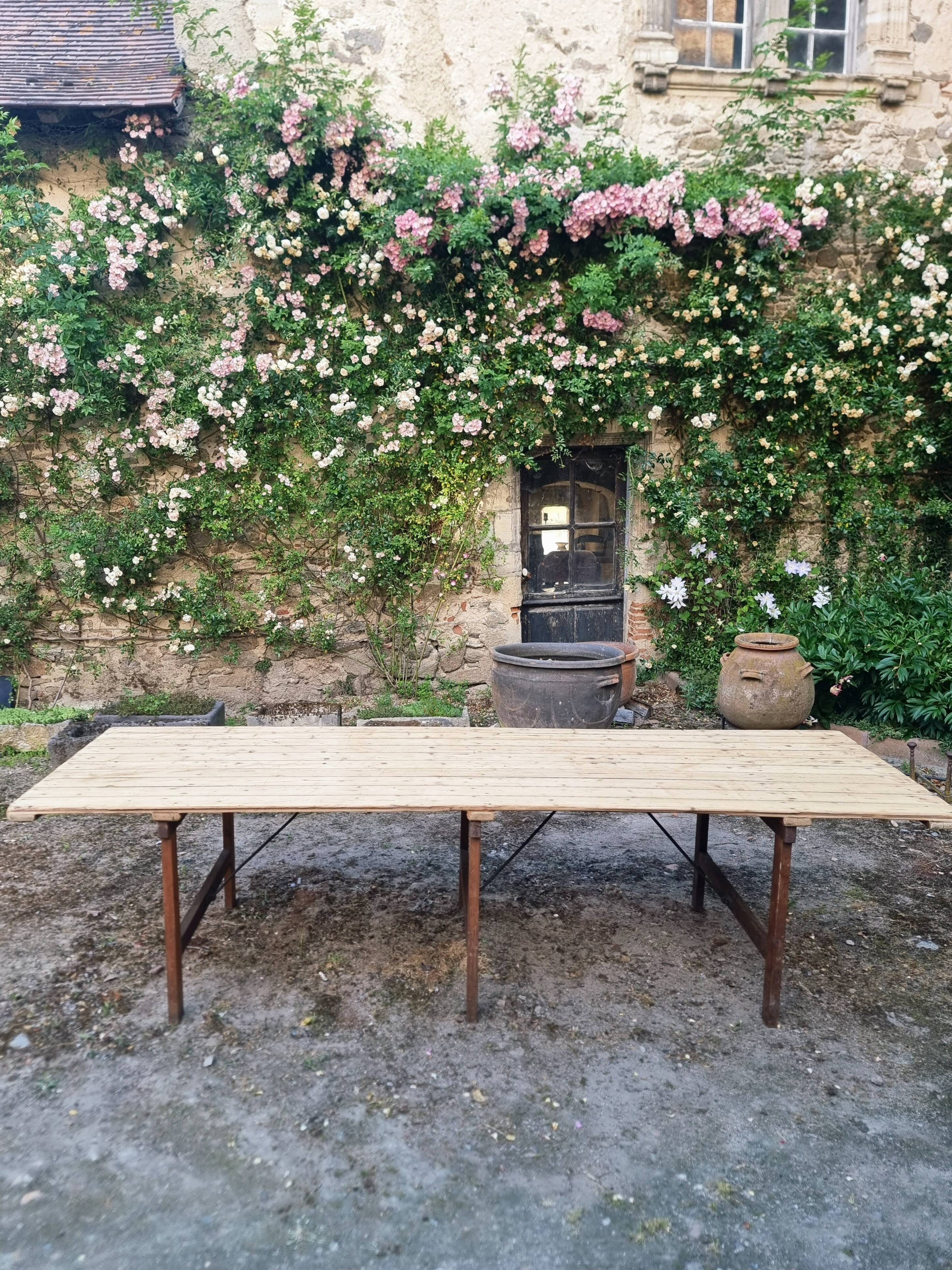 Antique French folding garden table set with benches, pine and chestnut, circa 1900–1920.