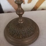 Old candlestick with chiseled bronze collar