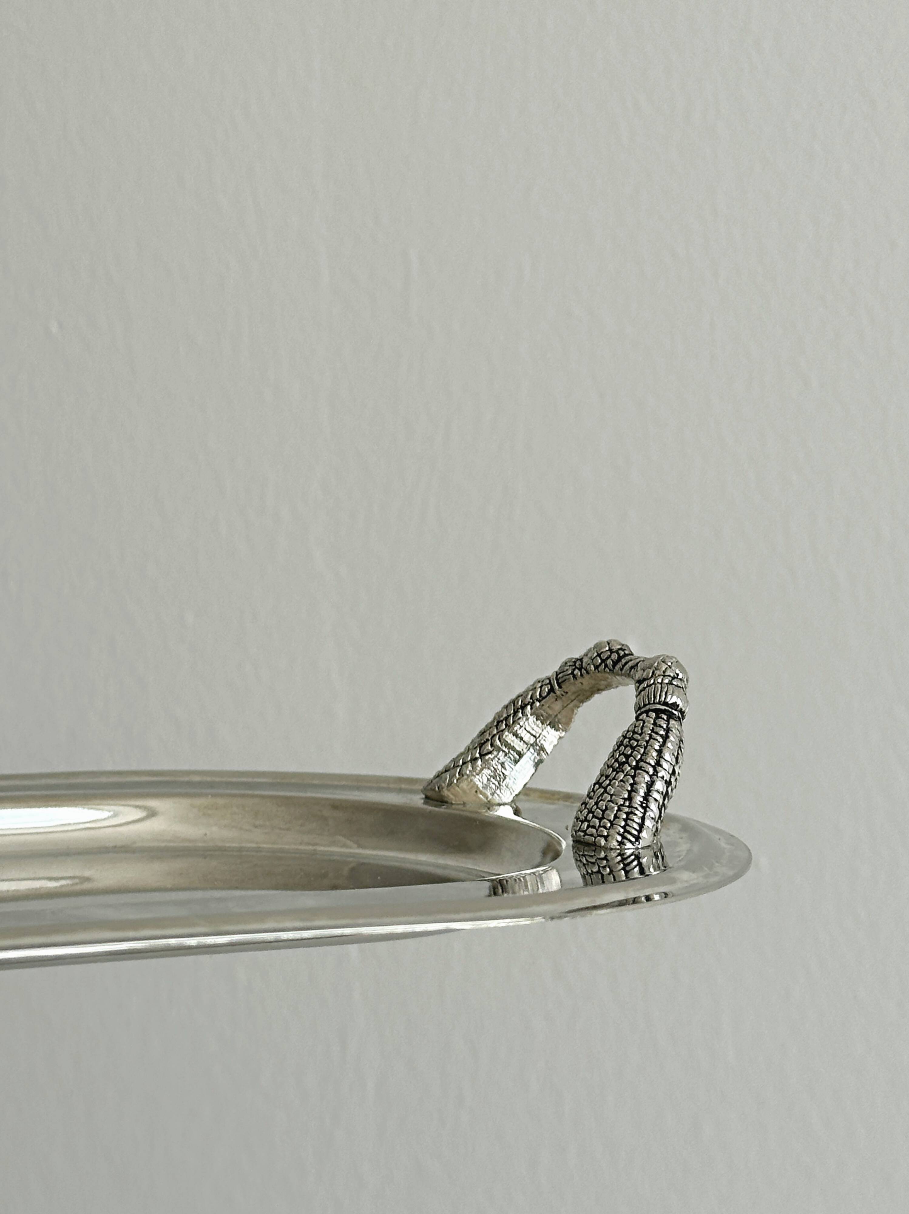 Vintage silver plateau with knot handles.