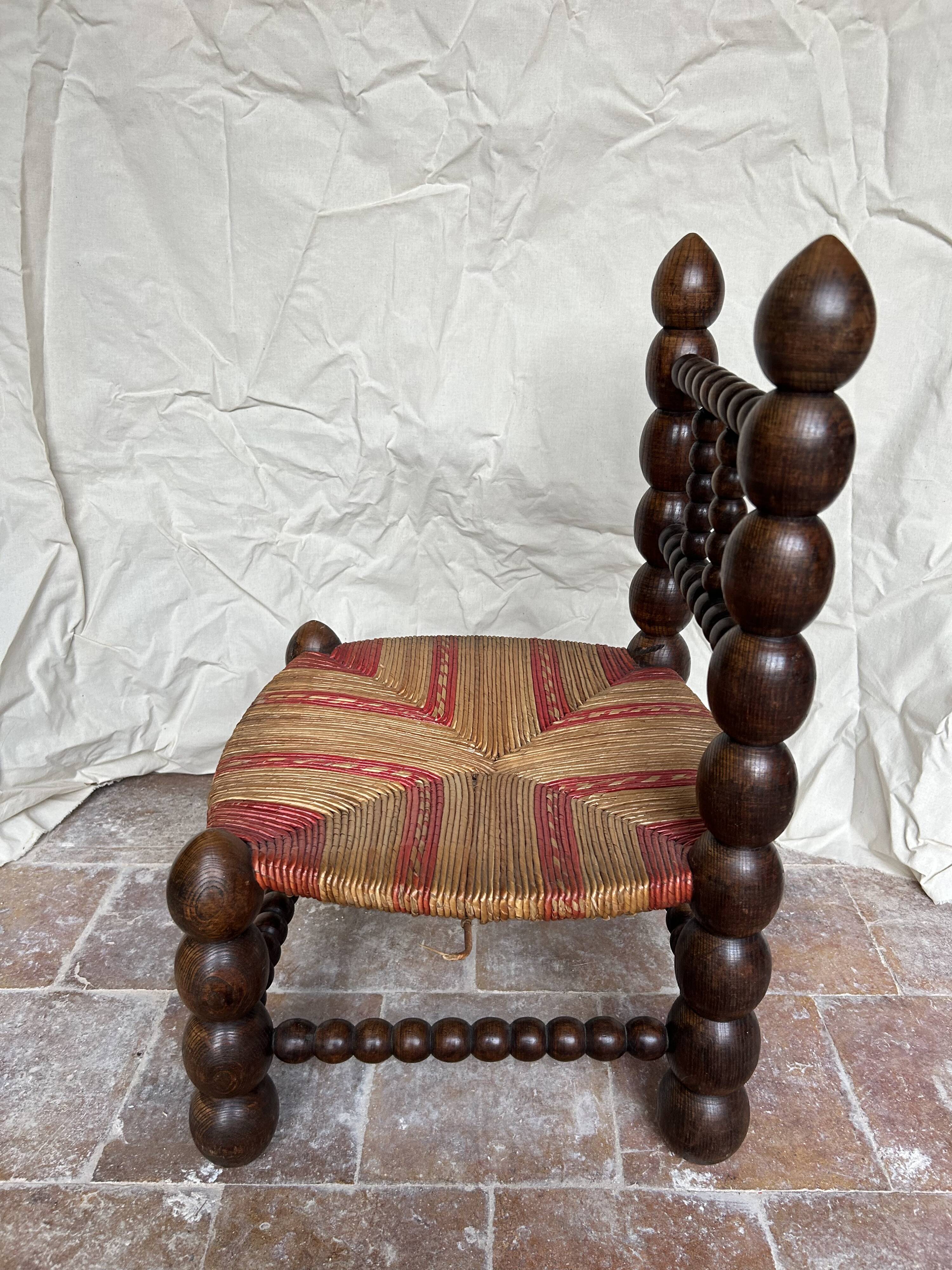 Turned wooden chair by Charles Dudouyt