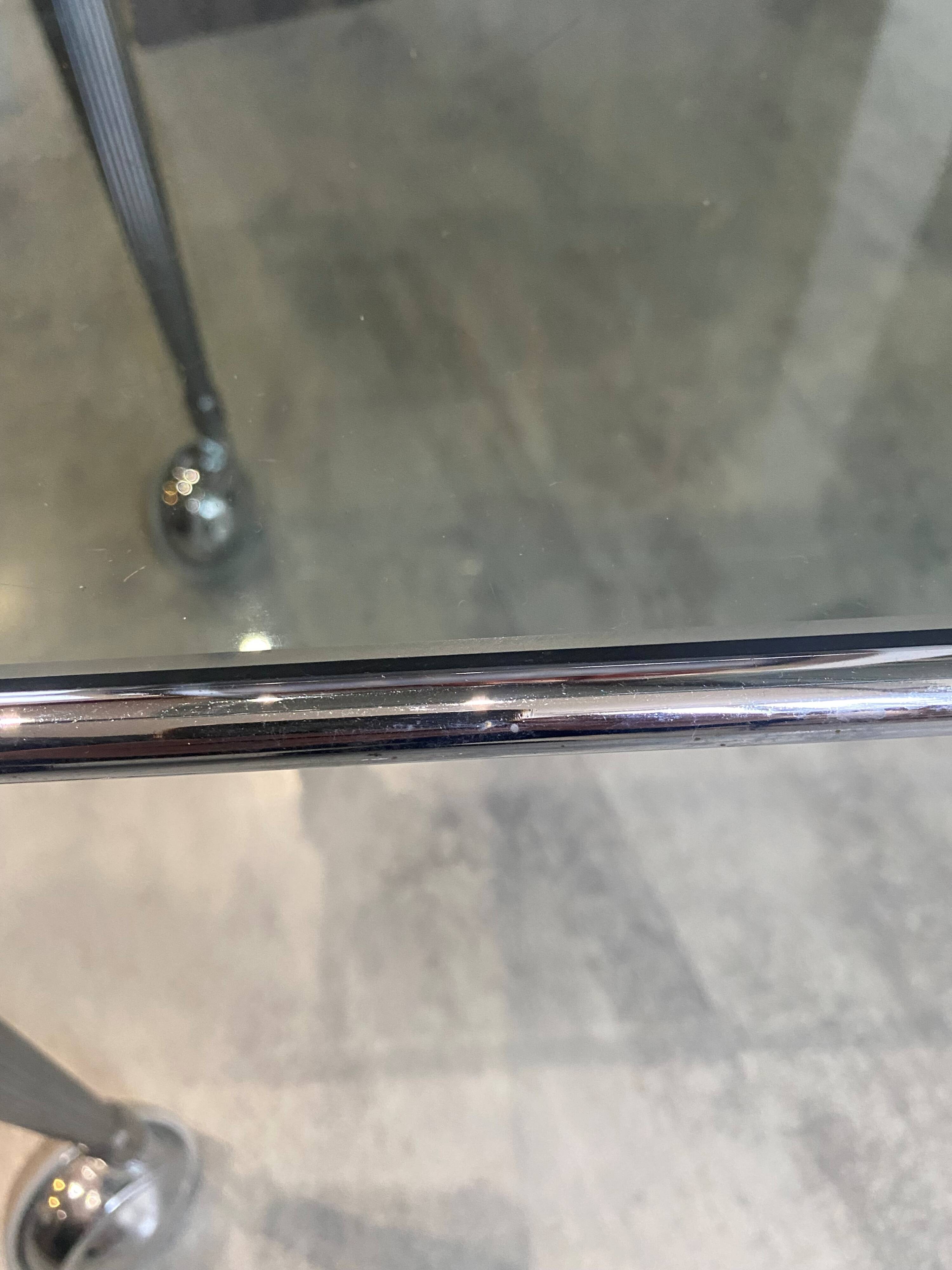 Vintage 1950s silver metal bar cart with wheels and two glass shelves