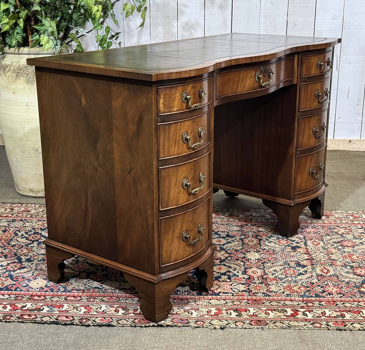 English desk from the 1950s in mahogany with a leather top.