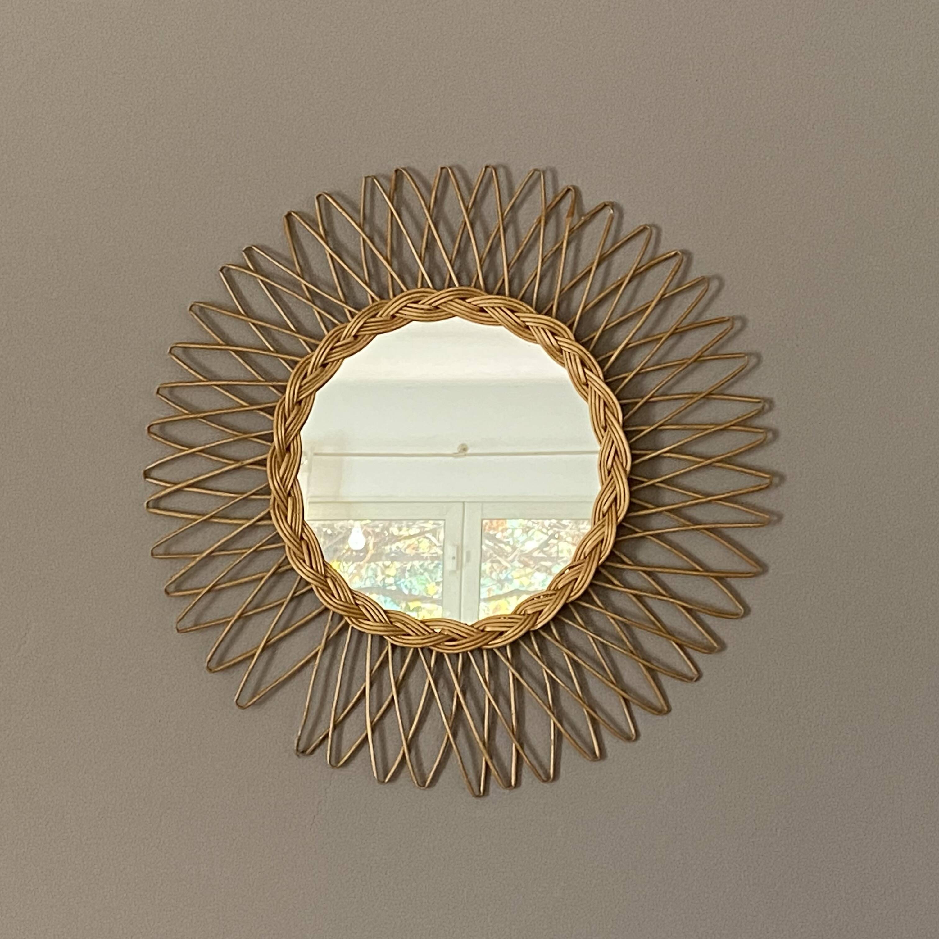 Sun mirror in woven rattan. 50cm. 1960.