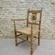 Fauteuil néo basque en bois clair et assise cannée