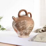 Old water jug. Gargoulette. Old terracotta pitcher.