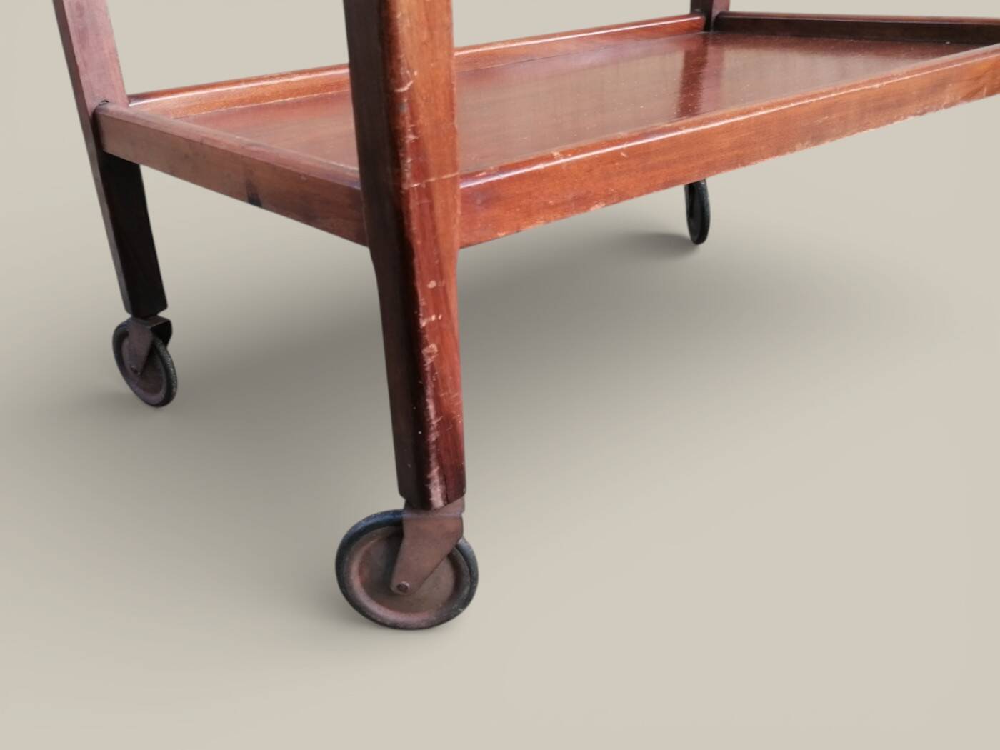 Art Deco wooden serving trolley on wheels.