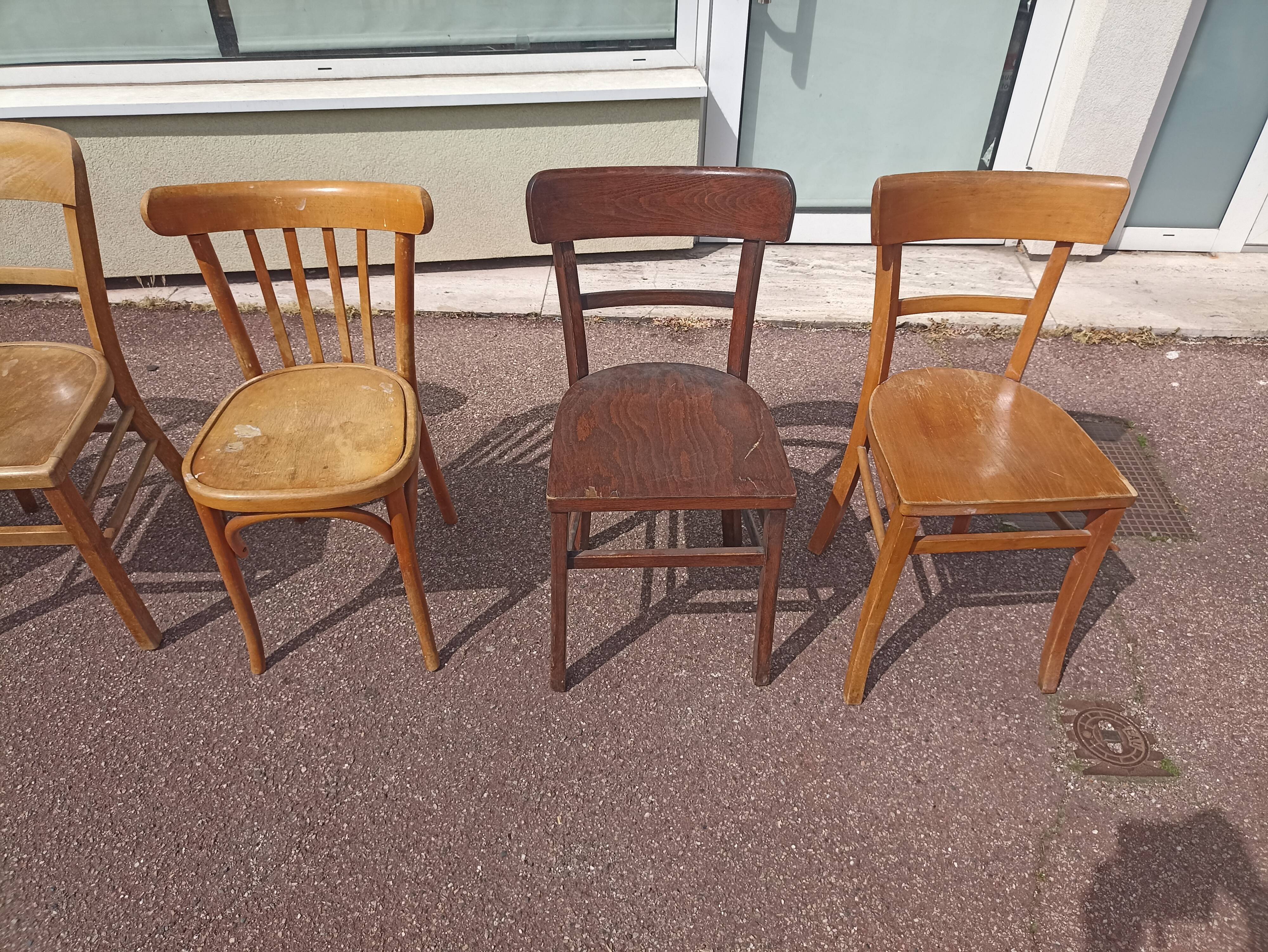 Set of 12 mismatched wooden bistro chairs