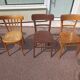 Set of 12 mismatched wooden bistro chairs