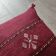 Burgundy Berber cushion with cotton pompom