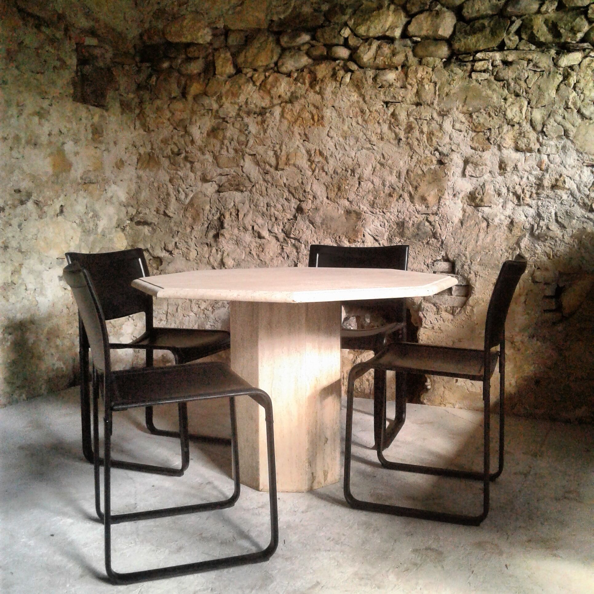 Octagonal table in travertine, 80s